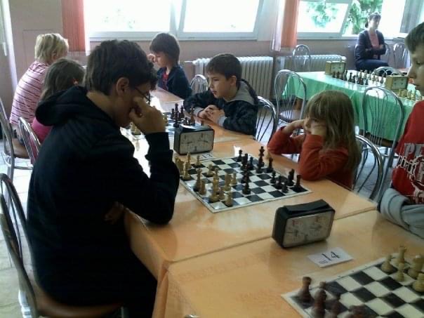 Viki playing chess young